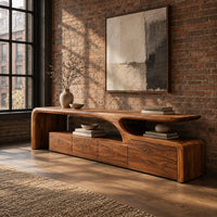 Low tv stand with a sweeping wave top and a four panel front in an industrial loft living room with exposed brick