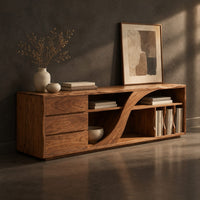 Corner detail of low tv stand with three drawers and a swooping divider beside vertical slots beside wood, brass and linen samples