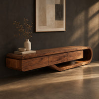 Low tv stand with a three panel front and a sweeping curved loop base, three-quarter view showing the grain