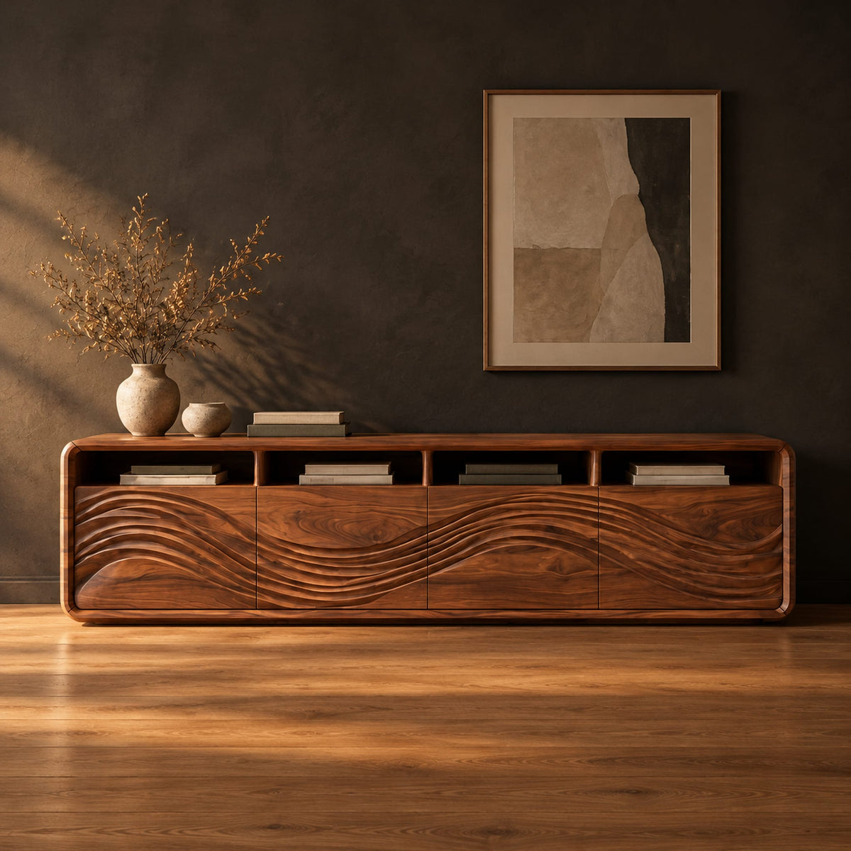 Low tv stand with four open cubbies above wave carved front panels in a dark studio against a charcoal plaster wall