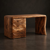 Makeup vanity desk with four wave carved drawers and a single slab leg, three-quarter view showing the grain