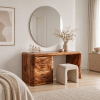 Makeup vanity desk with four wave carved drawers and a single slab leg in a Scandinavian bedroom with white walls