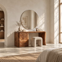 Makeup vanity desk with four wave carved drawers and a single slab leg in a bright open plan bedroom