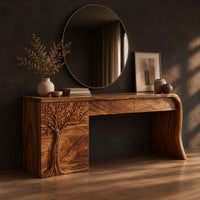 Makeup vanity with a carved tree pedestal and a sweeping slab leg, three-quarter view showing the grain