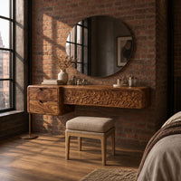 Makeup vanity with a carved vine panel, two drawers and a slim post leg in an industrial loft bedroom with exposed brick