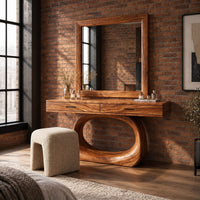 Makeup vanity with a wide top and an open oval loop base in an industrial loft bedroom with exposed brick