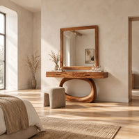 Makeup vanity with a wide top and an open oval loop base in a bright open plan bedroom