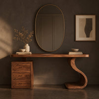 Corner detail of makeup vanity with an s curve pedestal and a three drawer cabinet beside wood, brass and linen samples