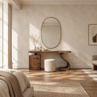 Makeup vanity with an s curve pedestal and a three drawer cabinet in a bright open plan bedroom