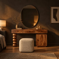 Makeup vanity with three drawers a stacked bead leg and a side cabinet in a dark bedroom at golden hour