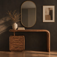 Corner detail of makeup vanity with a waterfall end and a three drawer cabinet beside wood, brass and linen samples