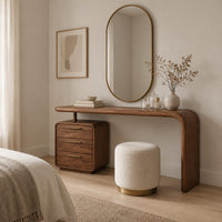 Makeup vanity with a waterfall end and a three drawer cabinet in a Scandinavian bedroom with white walls