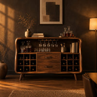 Mid century bar cabinet with a curved frame, square cubbies and two drawers in a dark dining room at golden hour