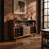Mid century bar cabinet with a curved frame, square cubbies and two drawers in an industrial loft dining room with exposed brick