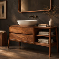 Corner detail of mid century wood vanity with two drawers and open side shelves on tapered legs beside wood, brass and linen samples