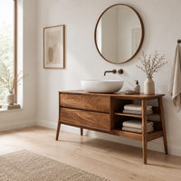 Mid century wood vanity with two drawers and open side shelves on tapered legs in a Scandinavian bathroom with white walls