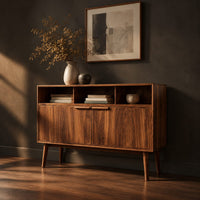 Mid century console table with three open cubbies and two doors on tapered legs, three-quarter view showing the grain