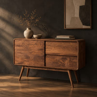 Low cabinet style console table with three wood panels on splayed legs, three-quarter view showing the grain