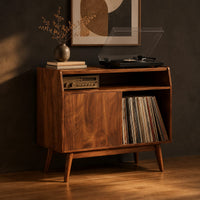 Mid century record player stand with one flat door and tapered legs, three-quarter view showing the grain