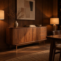 Mid century sideboard with three drawers and tapered legs in an evening dining room with walnut wall paneling
