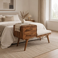 Mid century bench with a two drawer cabinet end and a cushioned seat in a Scandinavian bedroom with white walls