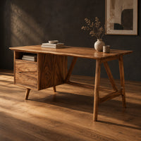 Mid century desk with a drawer pedestal, open cubby and angled trestle legs, three-quarter view showing the grain
