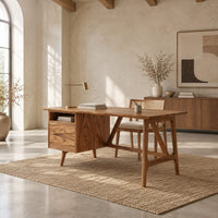 Mid century desk with a drawer pedestal, open cubby and angled trestle legs in a bright open plan home office