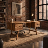 Mid century writing desk with two drawers and splayed legs in an industrial loft home office with exposed brick