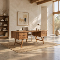 Mid century writing desk with two drawers and splayed legs in a bright open plan home office