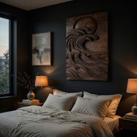 Dark wooden wall relief of a moon over waves above a bed in a dusk lit bedroom
