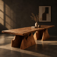 Live edge dining table on two wedge pedestals with jagged peak tops, three-quarter view showing the grain