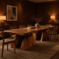 Live edge dining table on two wedge pedestals with jagged peak tops in an evening dining room with walnut wall paneling