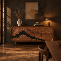 Mountain relief carved sideboard with a dark band and tapered legs in a dark dining room at golden hour