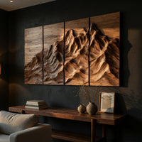 Four panel carved mountain wall art set above a low console in an evening living room