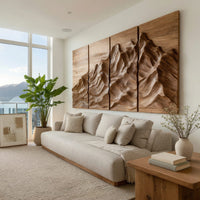 Four panel carved mountain wall art set in a bright sunroom with green plants