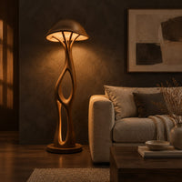 Mushroom canopy floor lamp with a slender sculpted stem and disc base in a dark living room at golden hour