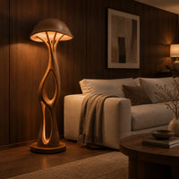 Mushroom canopy floor lamp with a slender sculpted stem and disc base in an evening living room with walnut wall paneling