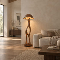Mushroom canopy floor lamp with a slender sculpted stem and disc base in a bright open plan living room