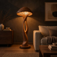 Floor lamp with a mushroom cap shade and a sculpted open stem in a dark living room at golden hour