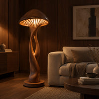Floor lamp with a mushroom cap shade and a sculpted open stem in an evening living room with walnut wall paneling