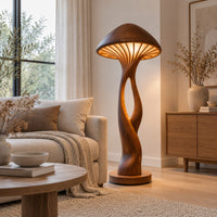 Floor lamp with a mushroom cap shade and a sculpted open stem in a Scandinavian living room with white walls