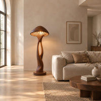 Floor lamp with a mushroom cap shade and a sculpted open stem in a bright open plan living room