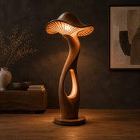 Mushroom shaped floor lamp with a ribbed cap and a glowing oval cutout in a dark studio against a charcoal plaster wall