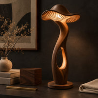 Corner detail of mushroom shaped floor lamp with a ribbed cap and a glowing oval cutout beside wood, brass and linen samples