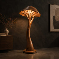 Mushroom floor lamp with a slim curving stem and a ribbed glowing cap, three-quarter view showing the grain