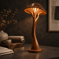 Corner detail of mushroom floor lamp with a slim curving stem and a ribbed glowing cap beside wood, brass and linen samples