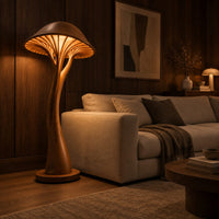 Mushroom floor lamp with a slim curving stem and a ribbed glowing cap in an evening living room with walnut wall paneling