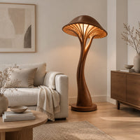 Mushroom floor lamp with a slim curving stem and a ribbed glowing cap in a Scandinavian living room with white walls