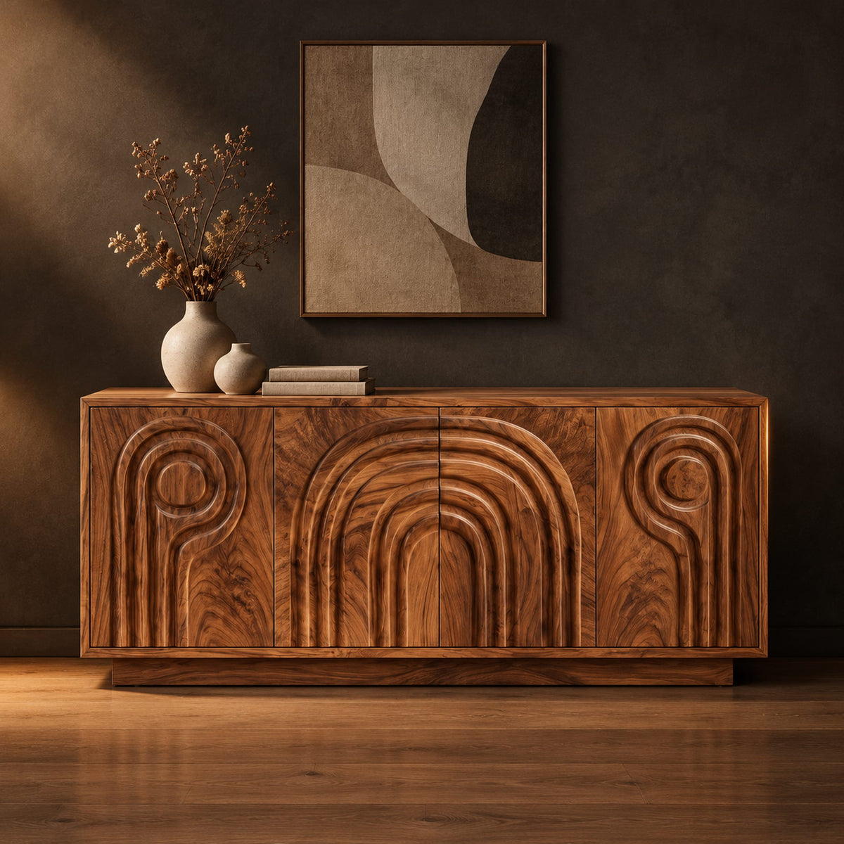 Sideboard with nested arch carving and spiral motifs on four doors in a dark studio against a charcoal plaster wall