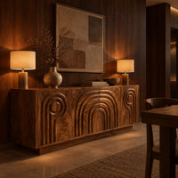 Sideboard with nested arch carving and spiral motifs on four doors in an evening dining room with walnut wall paneling